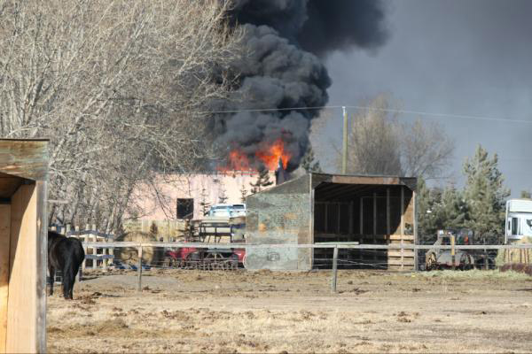 Garage east of Chestermere in flames and smoke