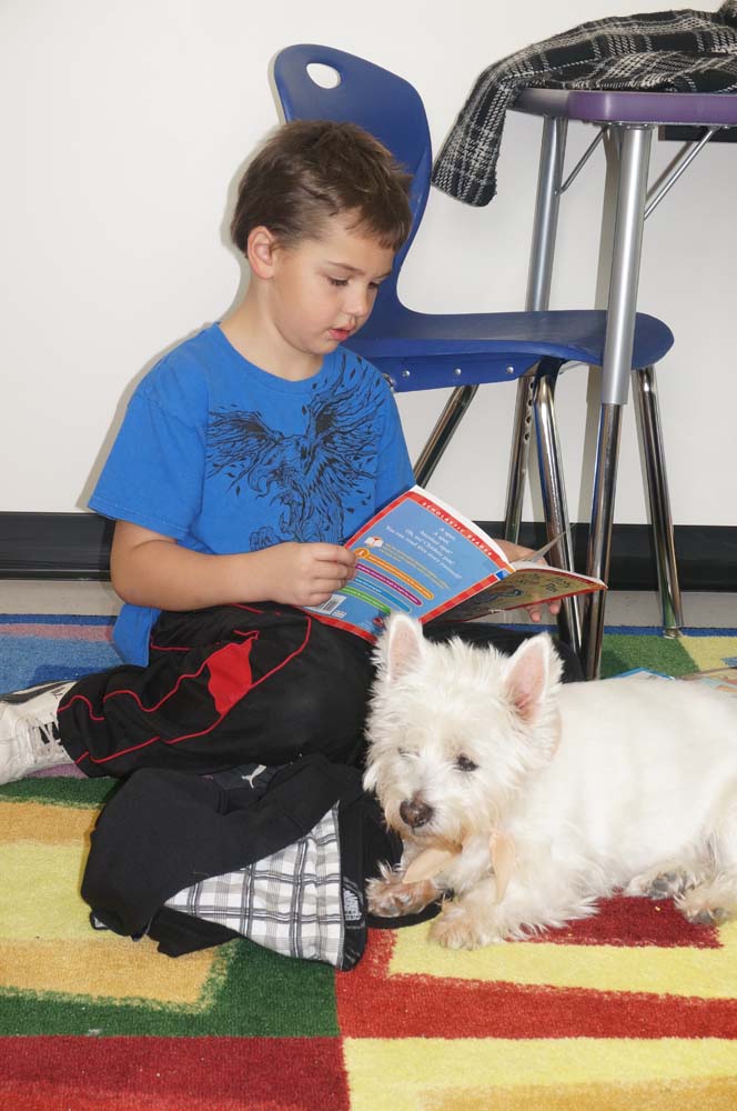 students getting reading help from a furry friend_001