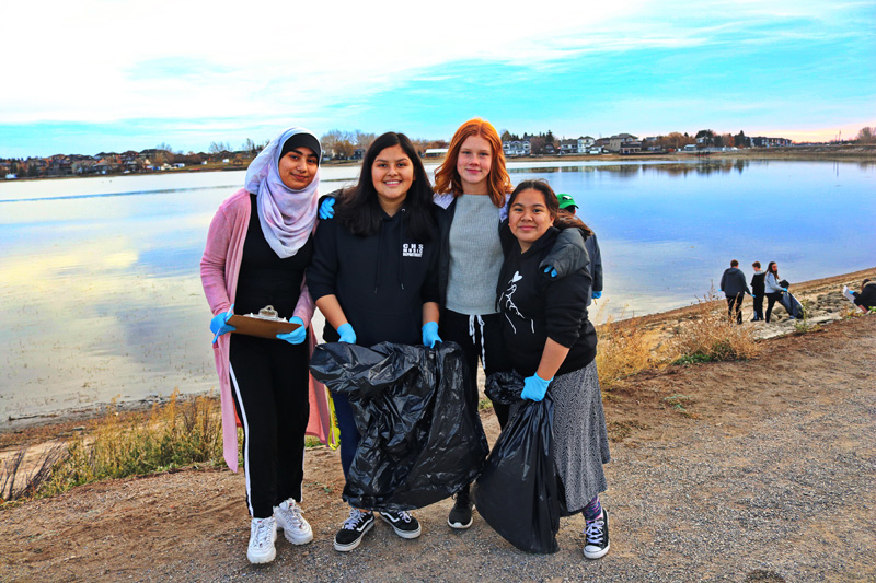 Chestermere Lake Middle Schoolers learn about the impact waste has on water ecosystems during shoreline clean-up pic 1x